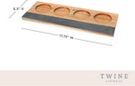 Twine tasting board displayed with soapstone chalk and wine glasses