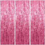 Shimmering metallic pink streamers background setup with balloons and party props