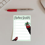 Close up view of rooster and chick illustrations on adhesive pages