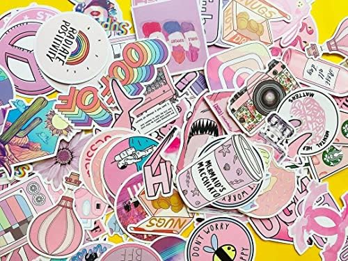 Wooowyet cute pink stickers being peeled cleanly off a laptop surface demonstrating residue free removal