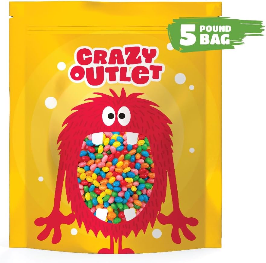 Top view of scattered Crazyoutlet fruit flavored jelly beans showcasing strawberry, lemon, and green apple pieces.