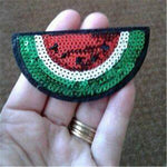 Close up of red and green sequin embroidery on watermelon patches