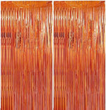 Two packs of metallic foil fringe streamers hanging on a party doorway.