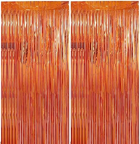 Two packs of metallic foil fringe streamers hanging on a party doorway.