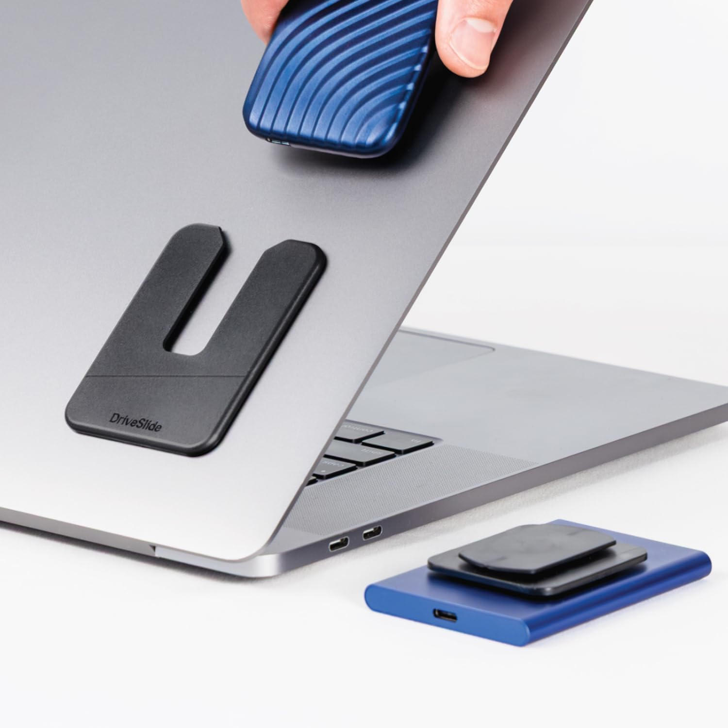 DriveSlide aesthetic portable laptop mounted external hard drive holder front view showcasing sleek lock design