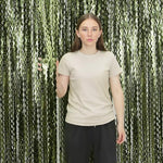 Peel and stick adhesive strip on the top of the green backdrop curtain.
