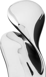 Close-up of smooth organic curves on Alessi Bulla stainless steel bar tool