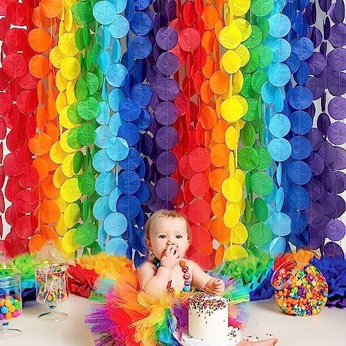 Sixteen individual packs of pinkblume multi color circle dot party garland banners laid out before installation