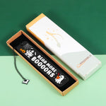 Lifestyle flatlay of the dark romance bookmark with bookish decor