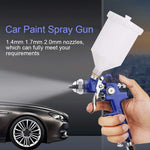 Included cleaning tools and accessories laid out alongside the spray gun kit
