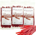 Soft and chewy old fashioned green apple licorice treats on a clean background