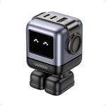 UGreen Uno 65W Robot GaN Charger front view showing the active LED expression screen and compact black design.
