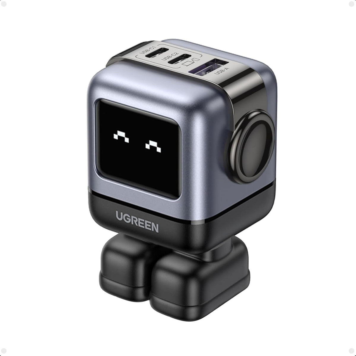 UGreen Uno 65W Robot GaN Charger front view showing the active LED expression screen and compact black design.