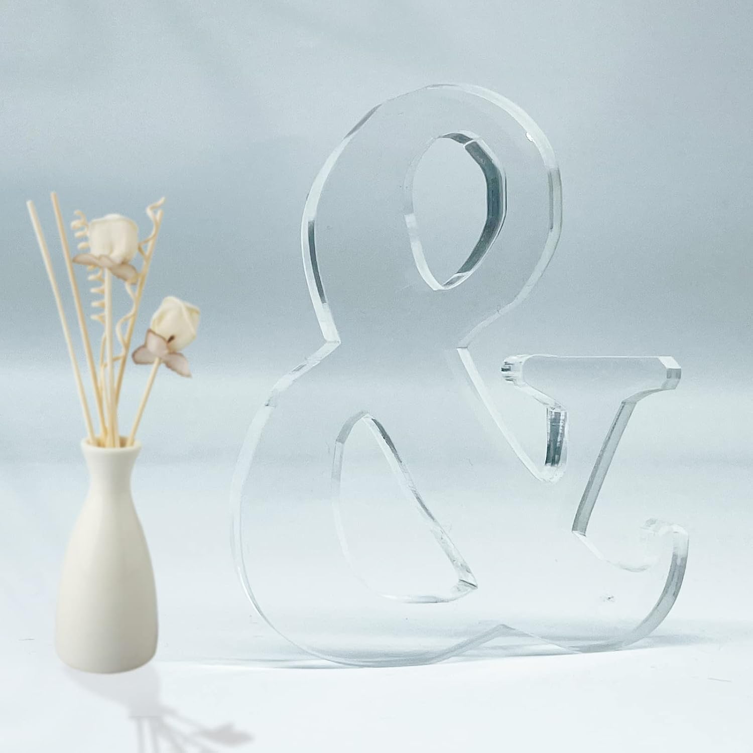 Woodounai 4 inch designable acrylic letters front view showcasing clear ampersand symbol for home decoration.