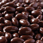 Roasted California almonds dipped in dairy-free dark chocolate close-up details