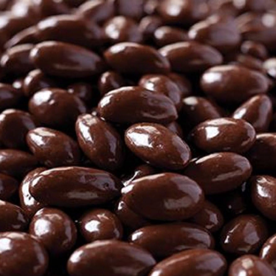Roasted California almonds dipped in dairy-free dark chocolate close-up details