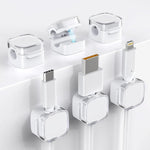 TIKIWIK magnetic cable clips six pack front view organizing clear white charging cords on a wooden office desk.
