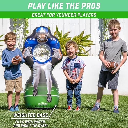 Group of kids playing the interactive touchdown toss game indoors in a playroom.