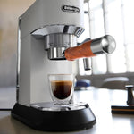 Espresso extraction stream flowing from bottomless basket