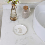 White ceramic jewelry tray showing gold trimmed edge details