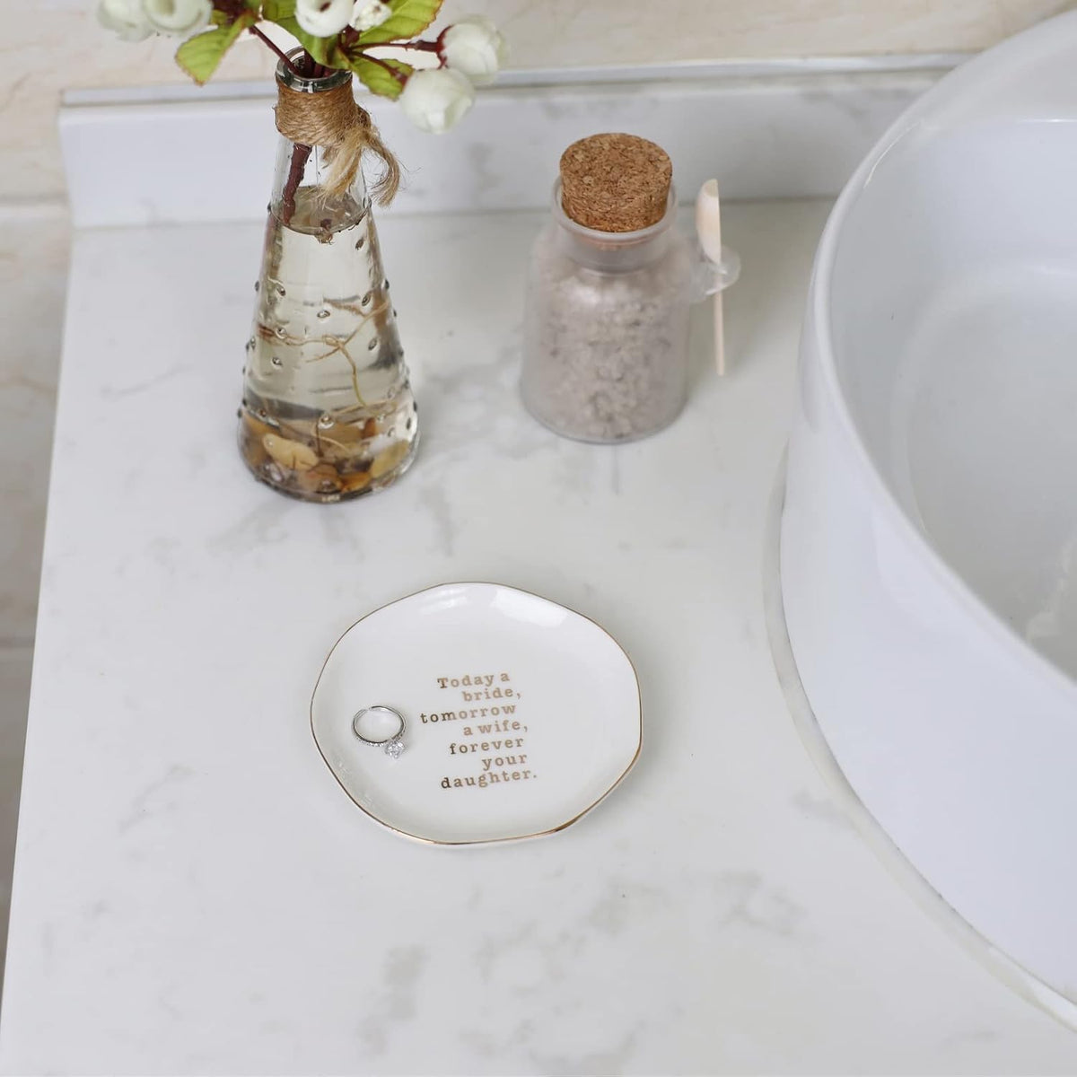 White ceramic jewelry tray showing gold trimmed edge details