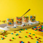 Premium imported dark chocolate M&M'S mixed with popcorn in a movie night snack bowl
