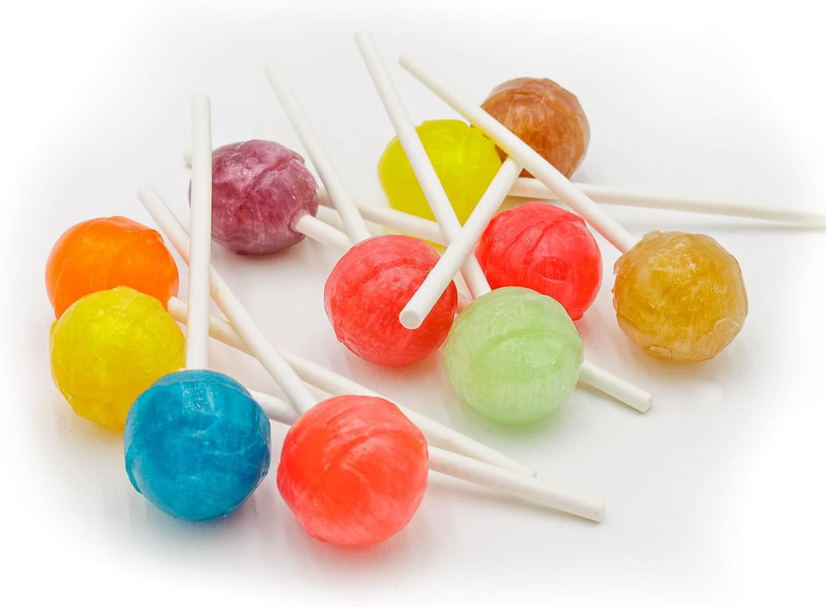 Assorted fruit flavored hard candy suckers on sticks arranged in a colorful circle