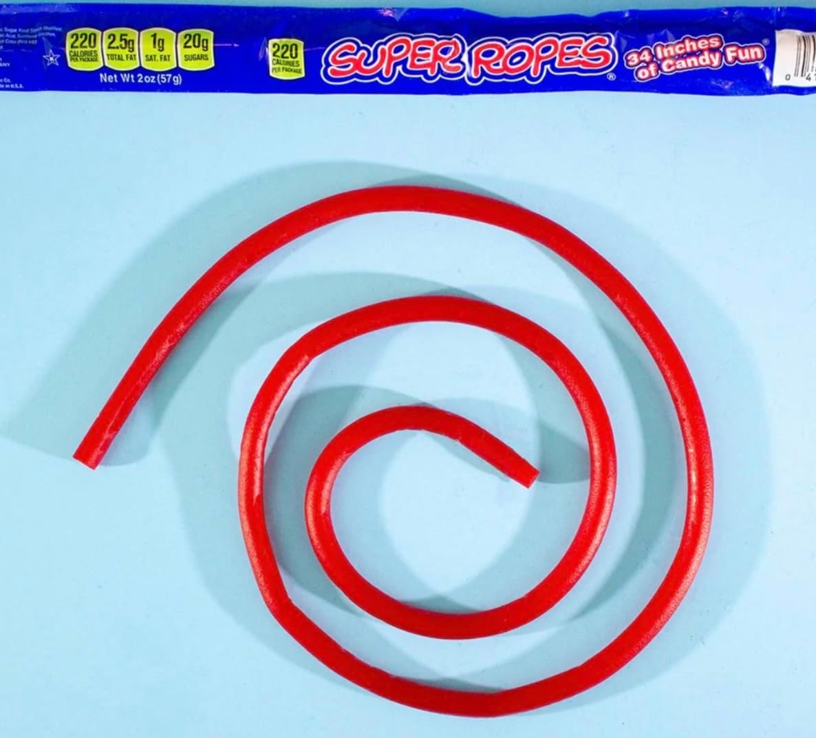 Close up of an individually wrapped 34 inch Red Vines Super Rope red licorice candy.