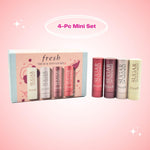 Fresh mini tinted lip balms lined up neatly