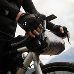 Roswheel road handlebar bag packed for bikepacking tour