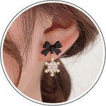 Zeshimb winter snowflake earrings sparkling under studio light