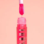 Milani vegan Vitamin E lip gloss swatches on skin
