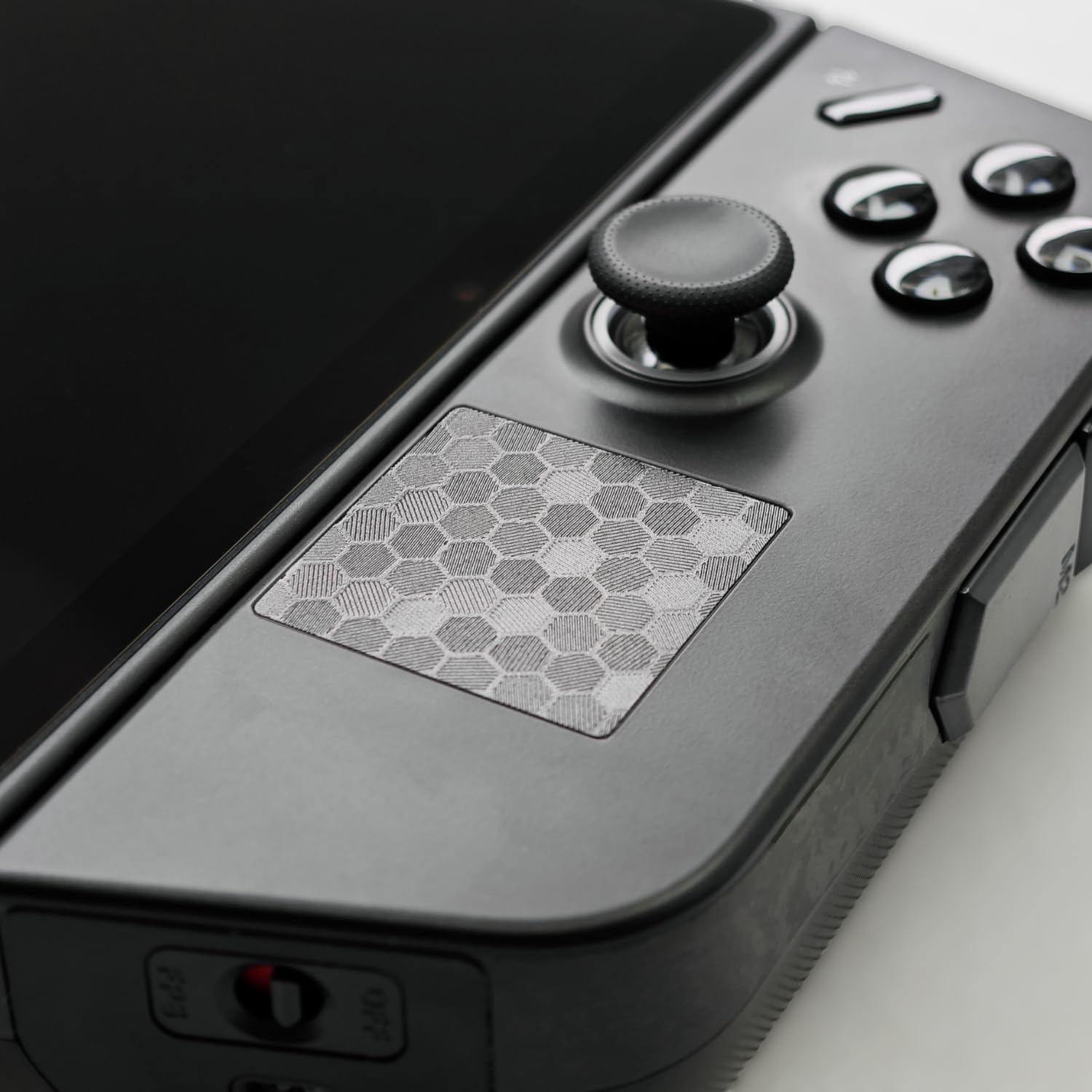 Luck&Link touchpad protector for Legion Go front view showing black honeycomb texture skin installed on the controller trackpad.