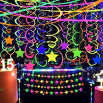 Fluorescent pink orange green and yellow spiral party decorations close up