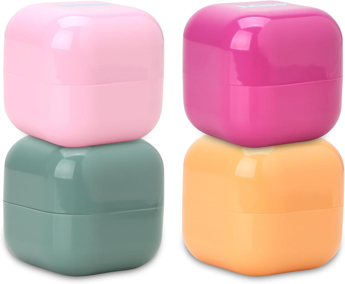 Bliss Travel Jars Set front view showing four square sage colored containers with lids