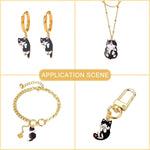 Close up of black cat charms for DIY necklace