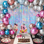 Four packs of iridescent glitter fringe backdrops arranged side by side on a wide photo booth wall