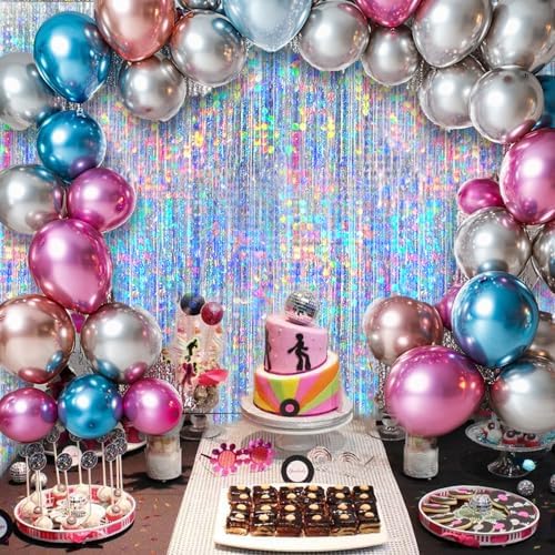 Four packs of iridescent glitter fringe backdrops arranged side by side on a wide photo booth wall