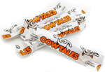 Fusion Sweets And Snacks Caramel Candy Vanilla soft textures being held to showcase the classic bite sized square shape.