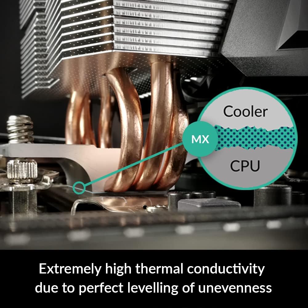 Arctic MX-4 thermal paste syringe resting alongside spatula