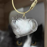Sencdfly pet memory bottle open with a small lock of cat hair inside