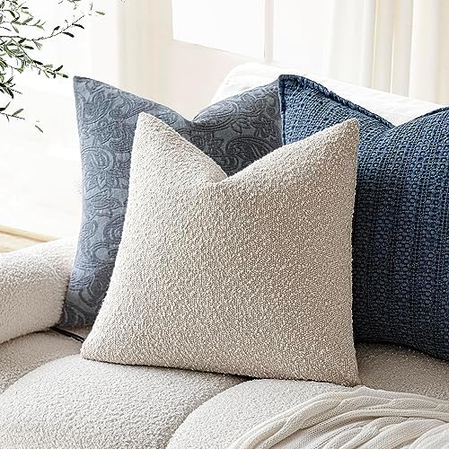 Set of two Foindtower decorative plush boucle cushion cases displayed together on an elegant accent chair