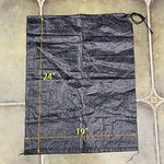 Jumbulk sandbags anchoring an outdoor tent in windy conditions