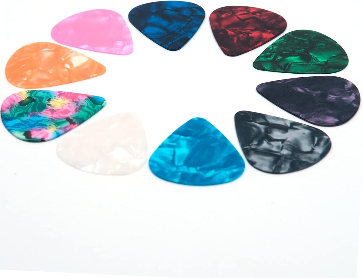 Close up of thin medium and heavy gauge guitar picks