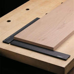 Woodworking planing stop set placed on table surface