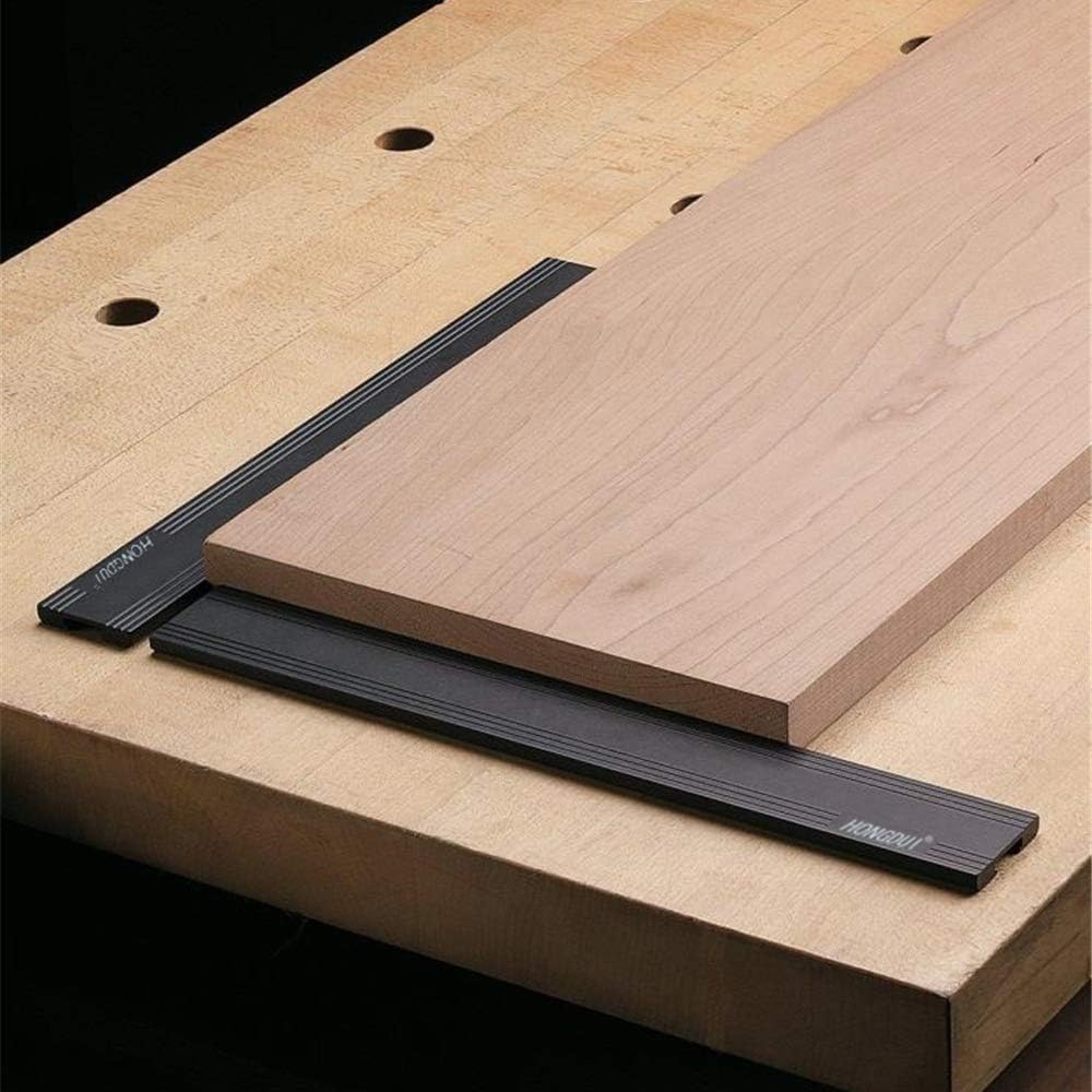 Woodworking planing stop set placed on table surface