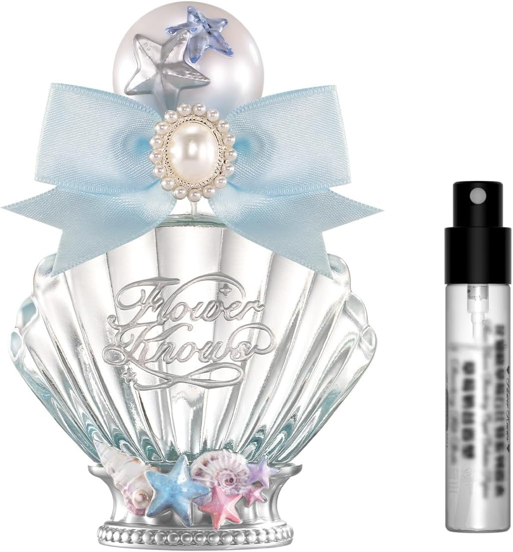 Flower Knows Shells Jewel Perfume front view of seashell bottle with light blue bow