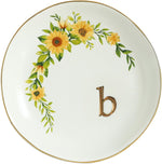 Lifestyle arrangement of bracelets and necklaces inside the ceramic dish