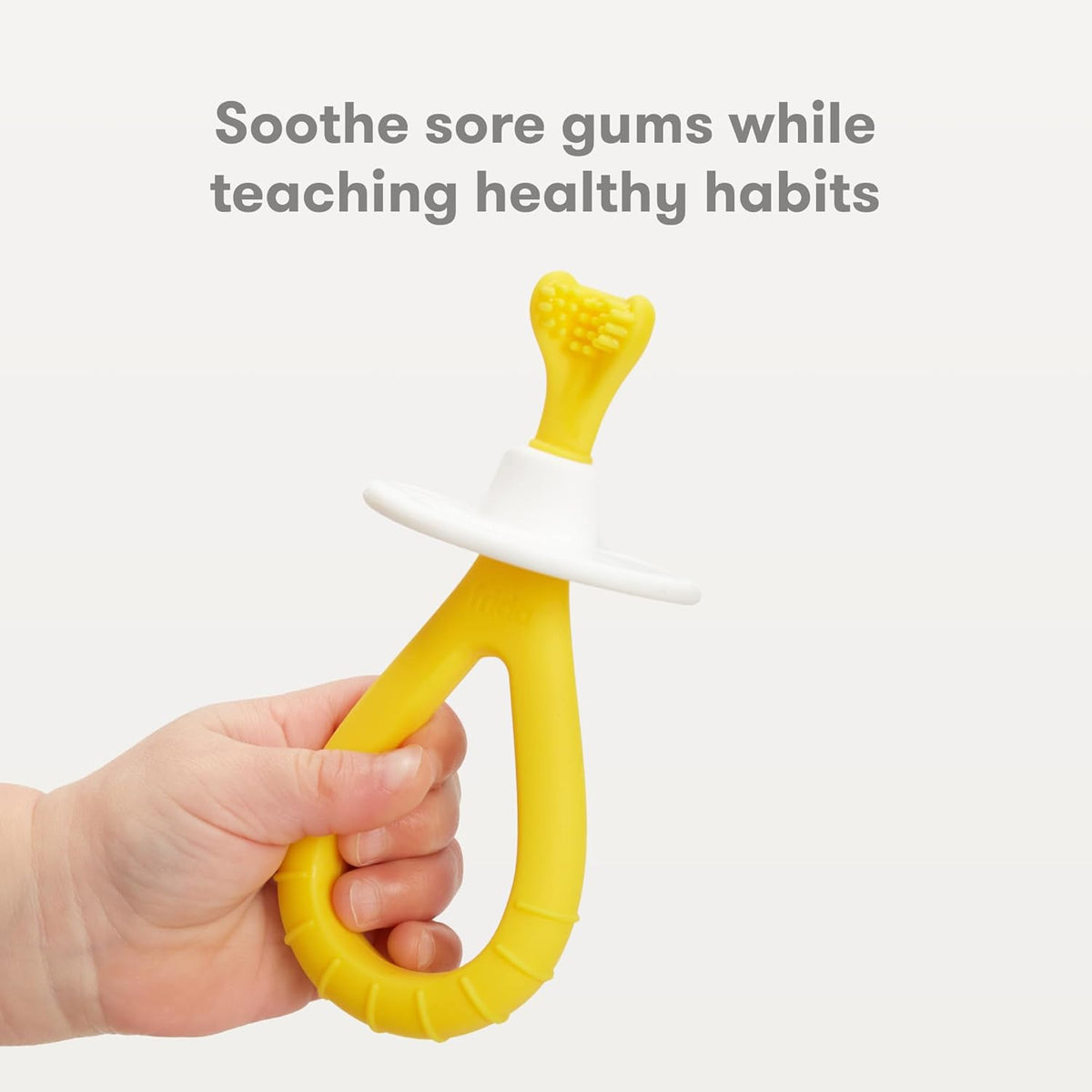 Frida silicone baby toothbrush yellow color