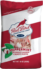 A handful of individually wrapped Red Bird soft peppermint candies highlighting the iconic red branding.